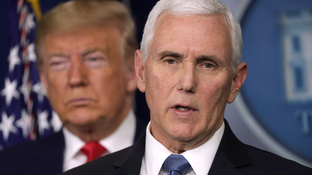 Mike Pence in the foreground of Donald Trump