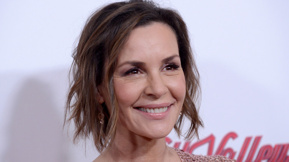 Embeth Davidtz smiling at premiere