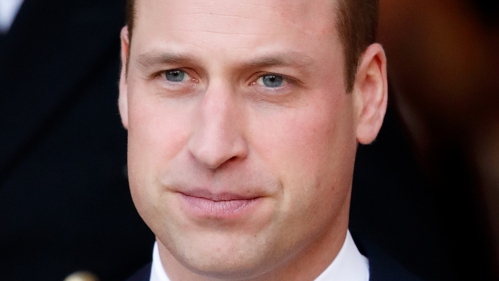 Prince William staring with a serious expression