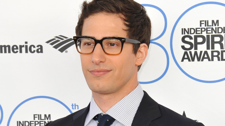 Andy Samberg slightly smiling