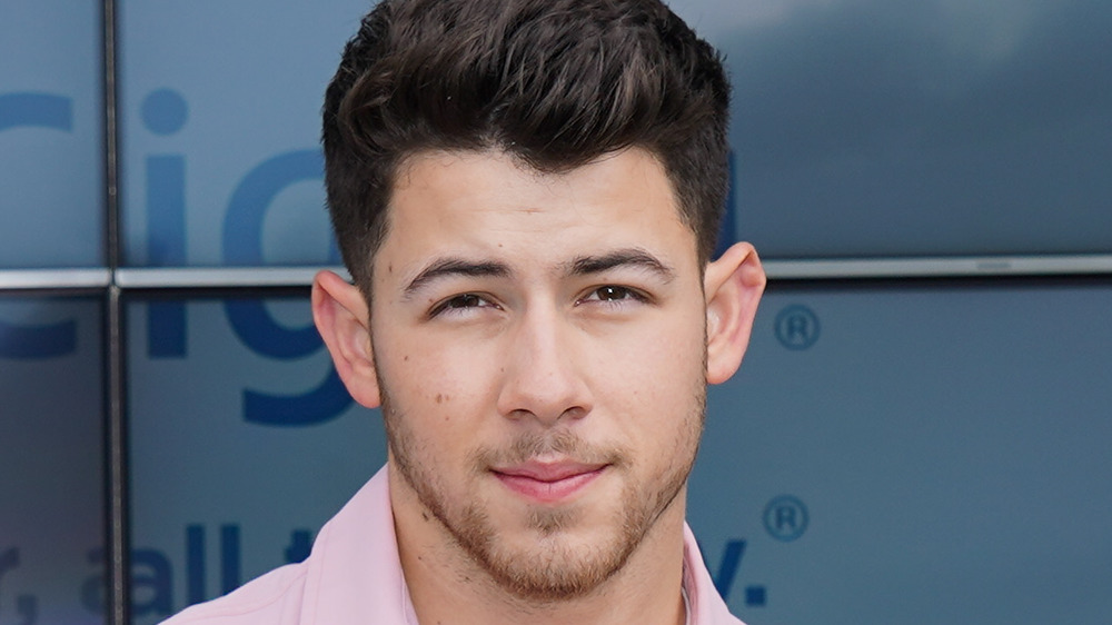 Nick Jonas posing on the red carpet