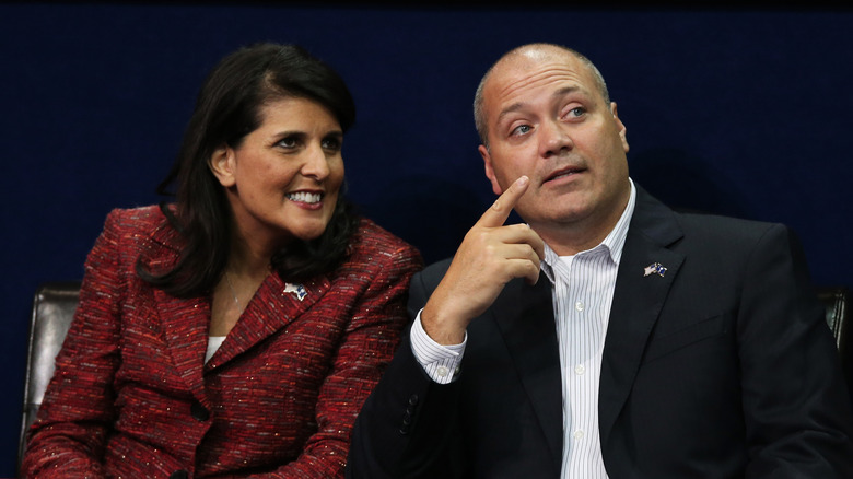 Nikki Haley talks with her husband