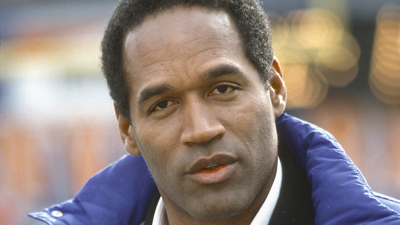 O.J. Simpson smiling in blue suit