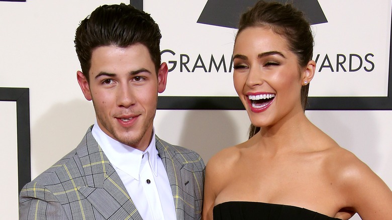 Olivia Culpo and Nick Jonas smiling