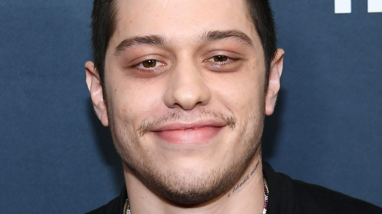 Pete Davidson smiling at an event