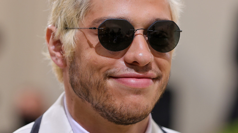 Pete Davidson with blonde hair and sunglasses