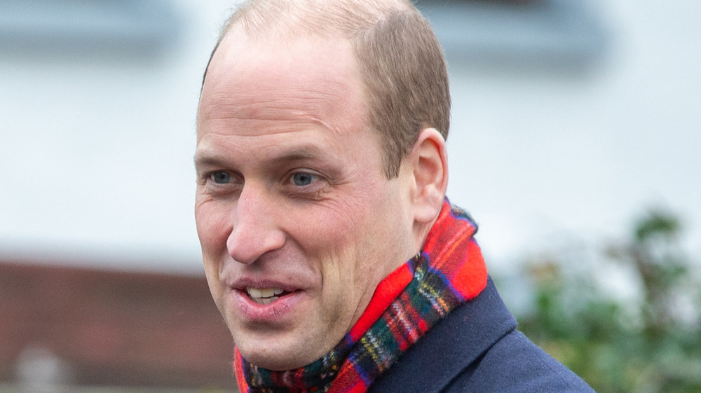 Prince William wearing a scarf outside
