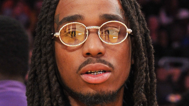 Quavo wearing yellow tinted glasses