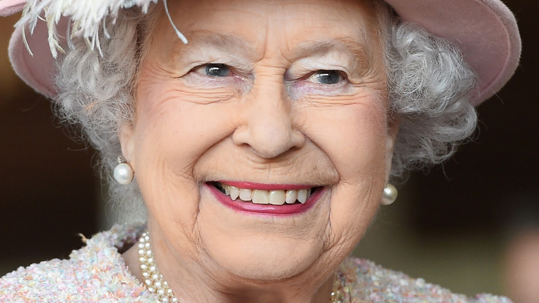 Queen Elizabeth II smiles for a photo 