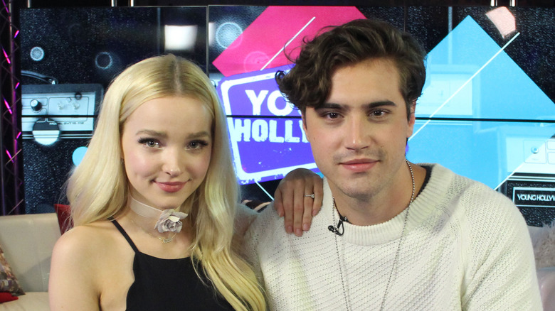 Dove Cameron and Ryan McCartan smiling and looking at camera