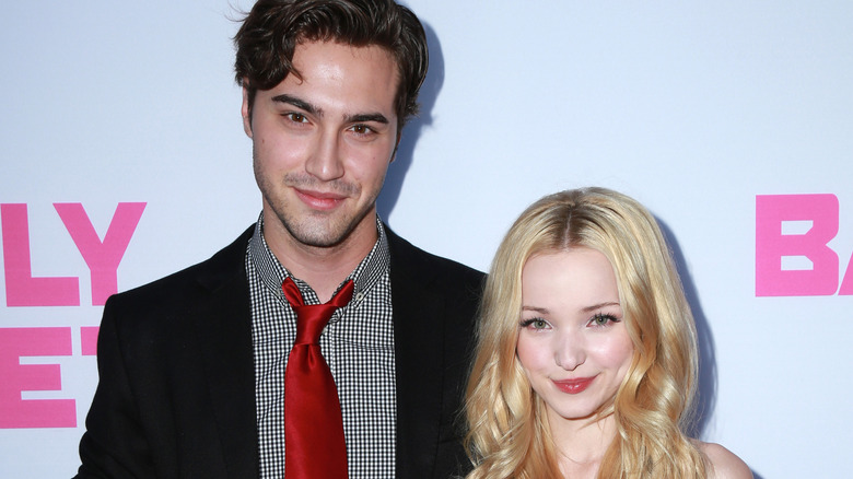 Ryan McCartan and Dove Cameron smiling on the red carpet
