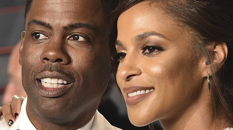 Chris Rock and Megalyn Echikunwoke smile