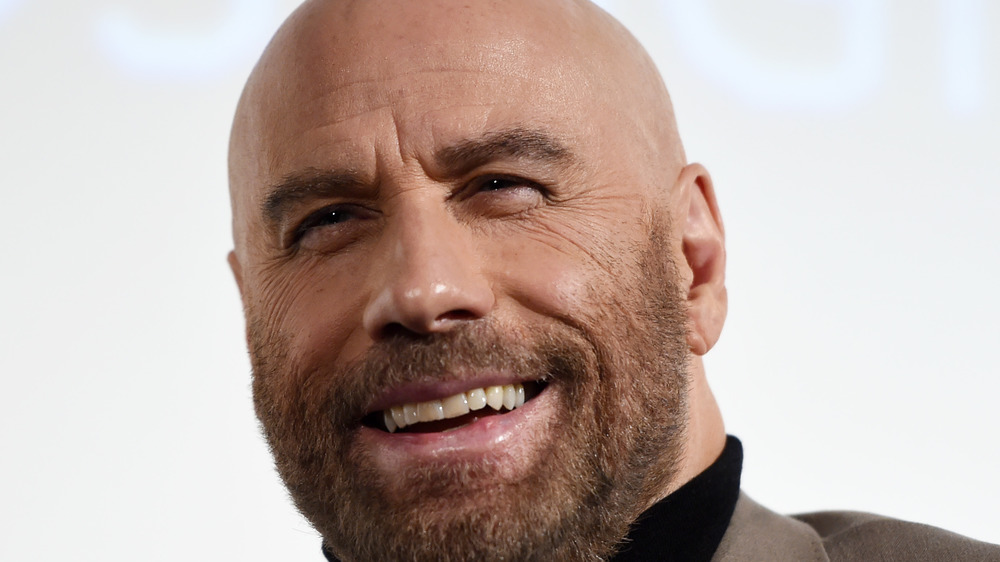 John Travolta smiles for the camera