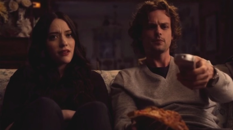 Kat Dennings beside Matthew Gray Gubler holding remote