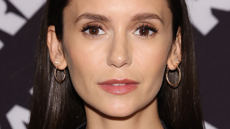 Nina Dobrev posing in 2022
