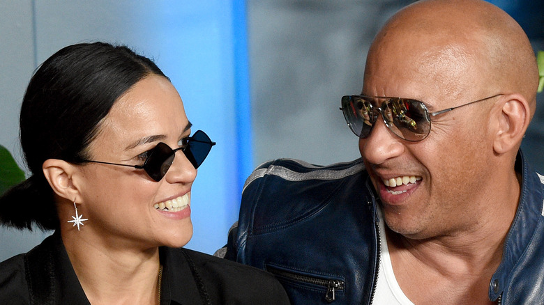 Michelle Rodriguez and Vin Diesel smiling at each other