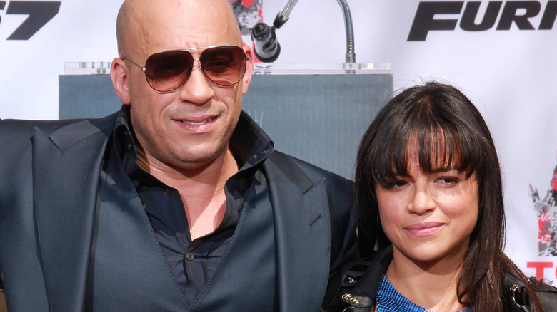 Vin Diesel with arm around Michelle Rodriguez