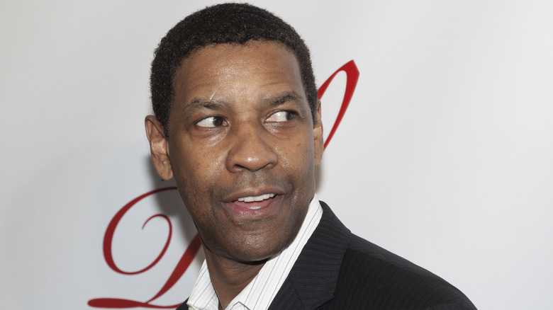 Denzel Washington looking left and smiling