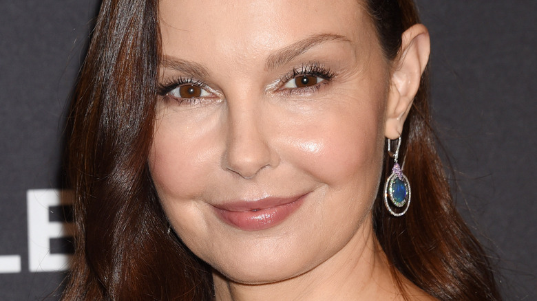 Ashley Judd wearing a blue earring.