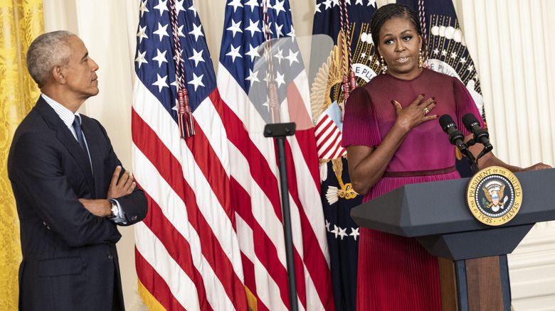 Michelle Obama speaking at a podium