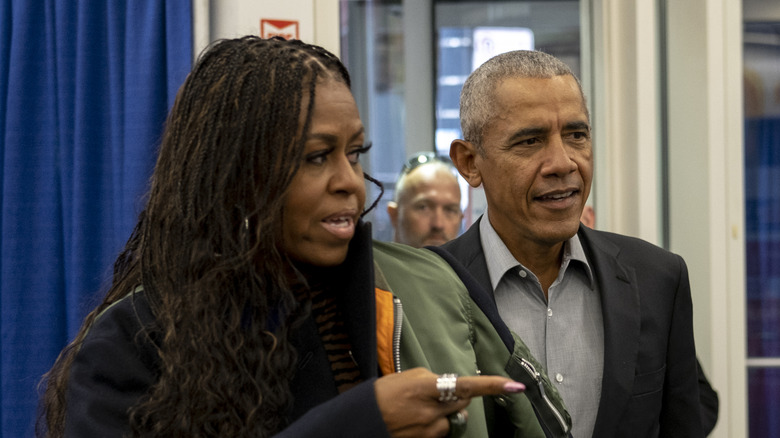 Michelle and Barack Obama arrive to cast their vote in 2022