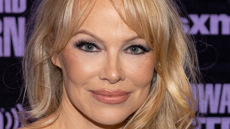 Pamela Anderson smiling for photo