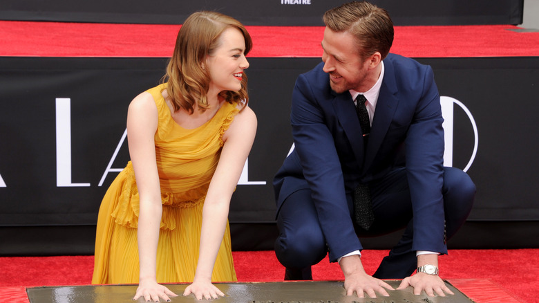 Ryan Gosling and Emma Stone pressing hands