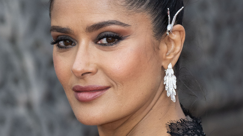 salma hayek smiling at an event 