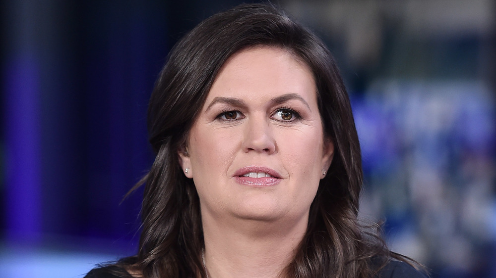 Sarah Huckabee Sanders looking off into the distance
