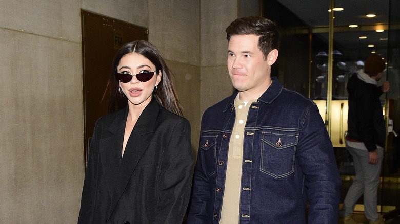 Sarah Hyland and Adam DeVine walking