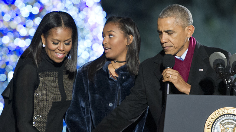 Sasha Obama with her parents