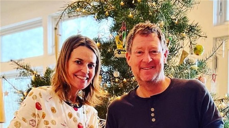 Savannah Guthrie and Michael Feldman smiling Christmas