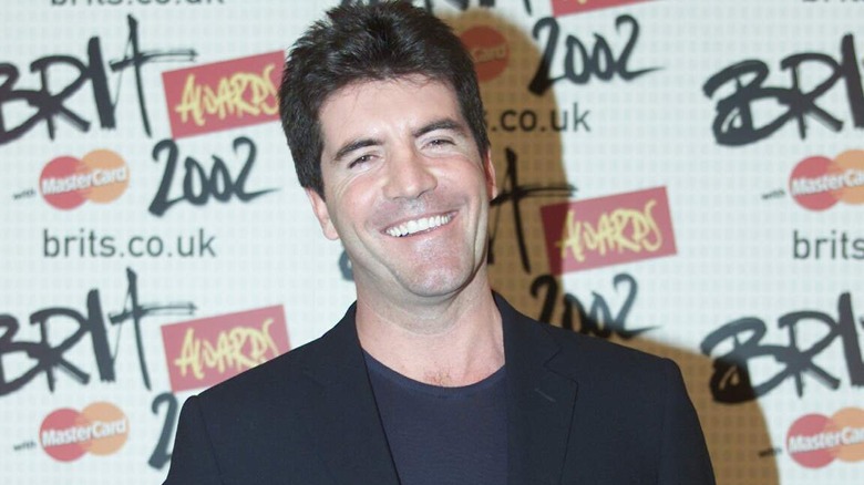Simon Cowell wears black blazer and black shirt