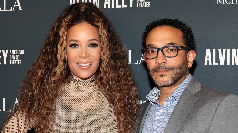 Sunny Hostin posed with Emmanuel Hostin posing