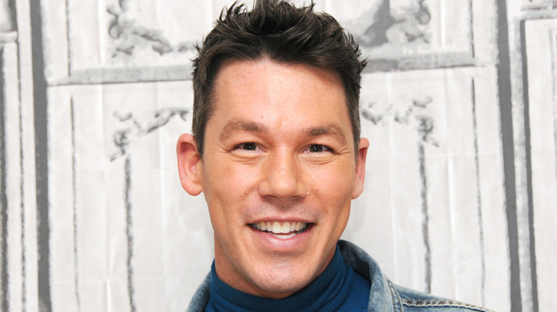 old, mid-2000s picture of David Bromstad smiling.