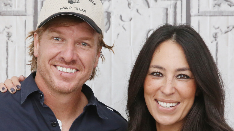 HGTV's Chip and Joanna Gaines smiling.