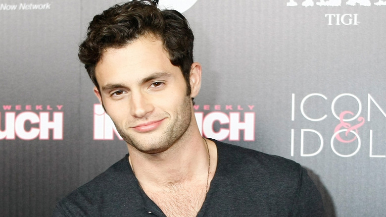 Penn Badgley at an event, smiling