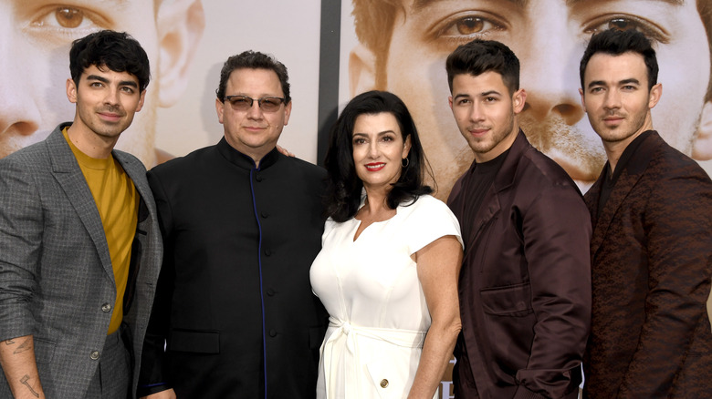 The Jonas Brothers and parents posing