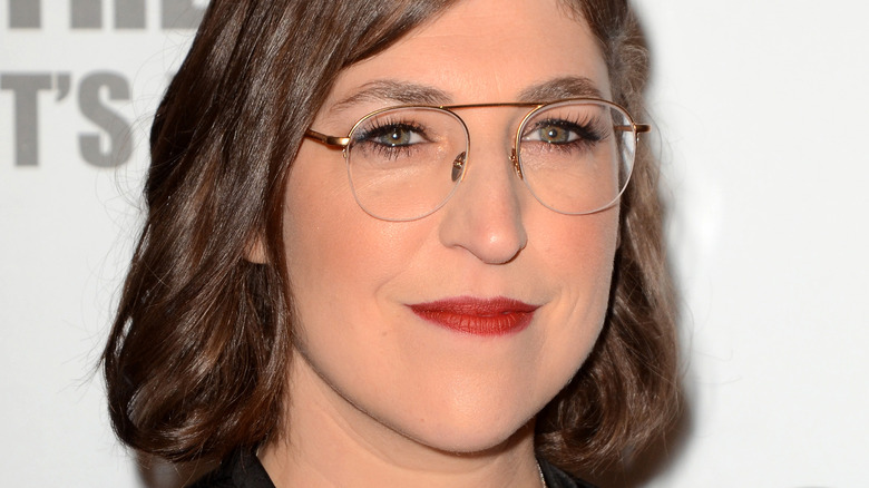 Mayim Bialik smiles on red carpet