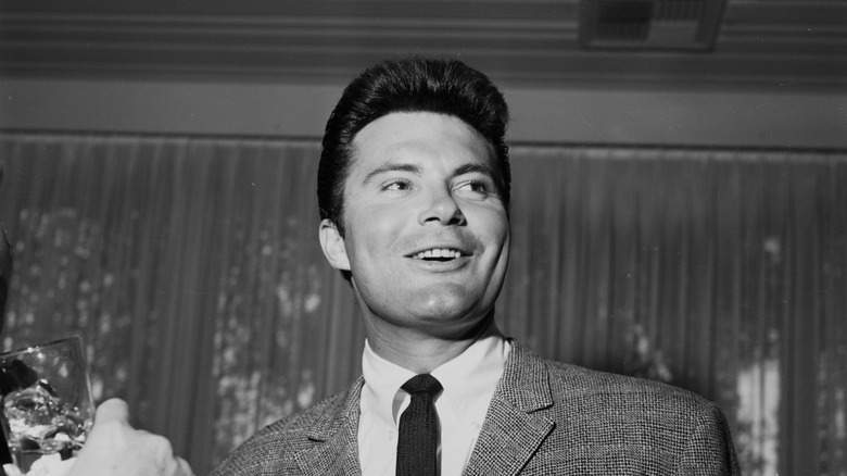 Max Baer Jr. smiles at a party in 1962.