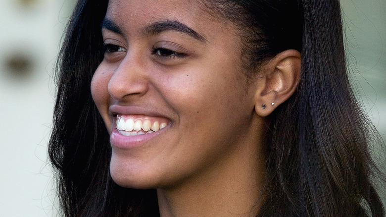 Malia Obama smiles at an event