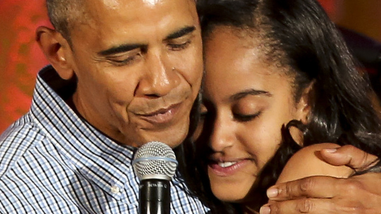 Barrack Obama hugs his daughter Malia