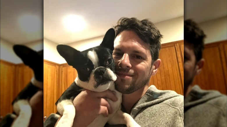 Dave Levey holding dog