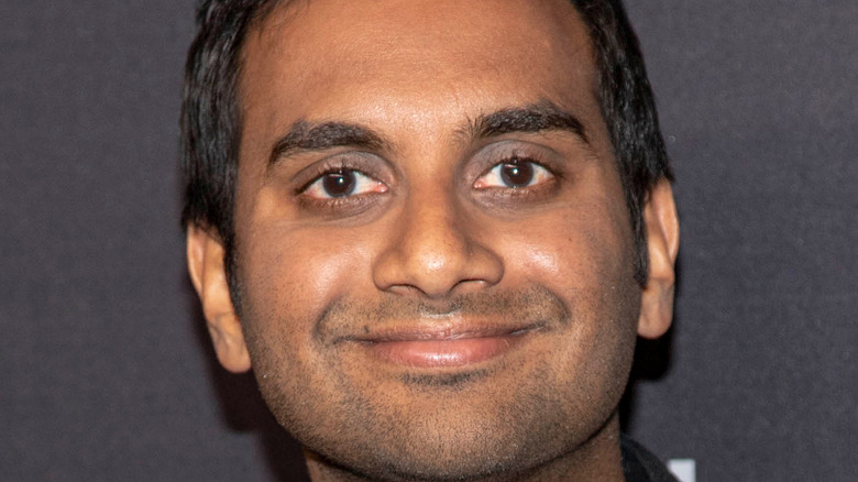 Aziz Ansari smiling