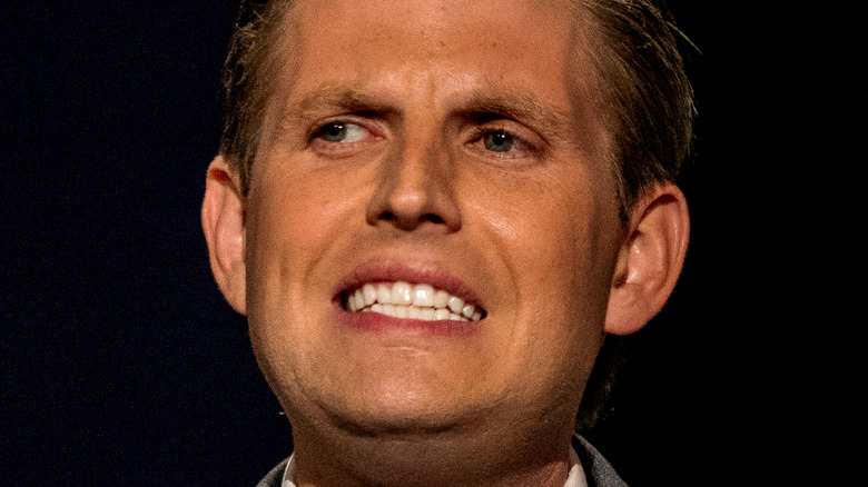 Eric Trump fake tan grimacing