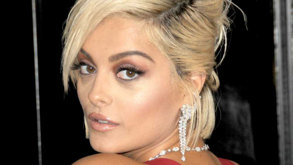 Bebe Rexha gazing over her shoulder on the Grammy Awards red carpet