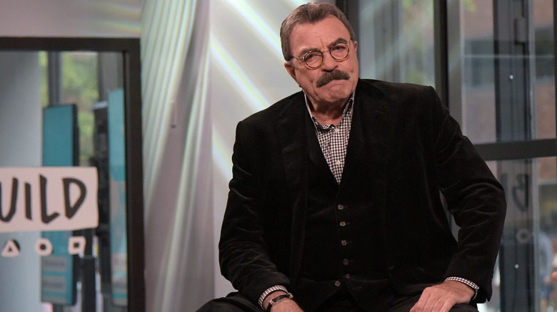 Tom Selleck sitting