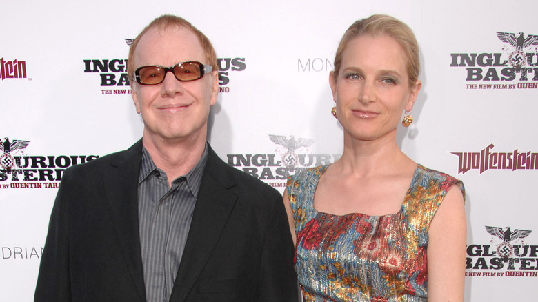 Danny Elfman and Bridget Fonda stand together