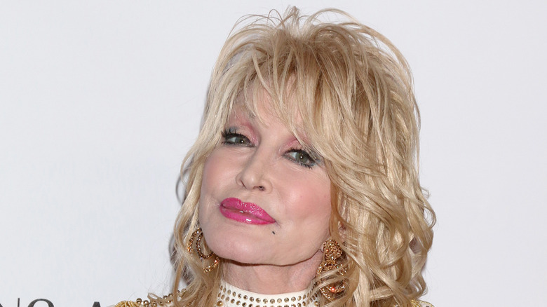 Dolly Parton gold drop earrings
