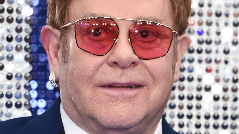 Elton John in pink sunglasses